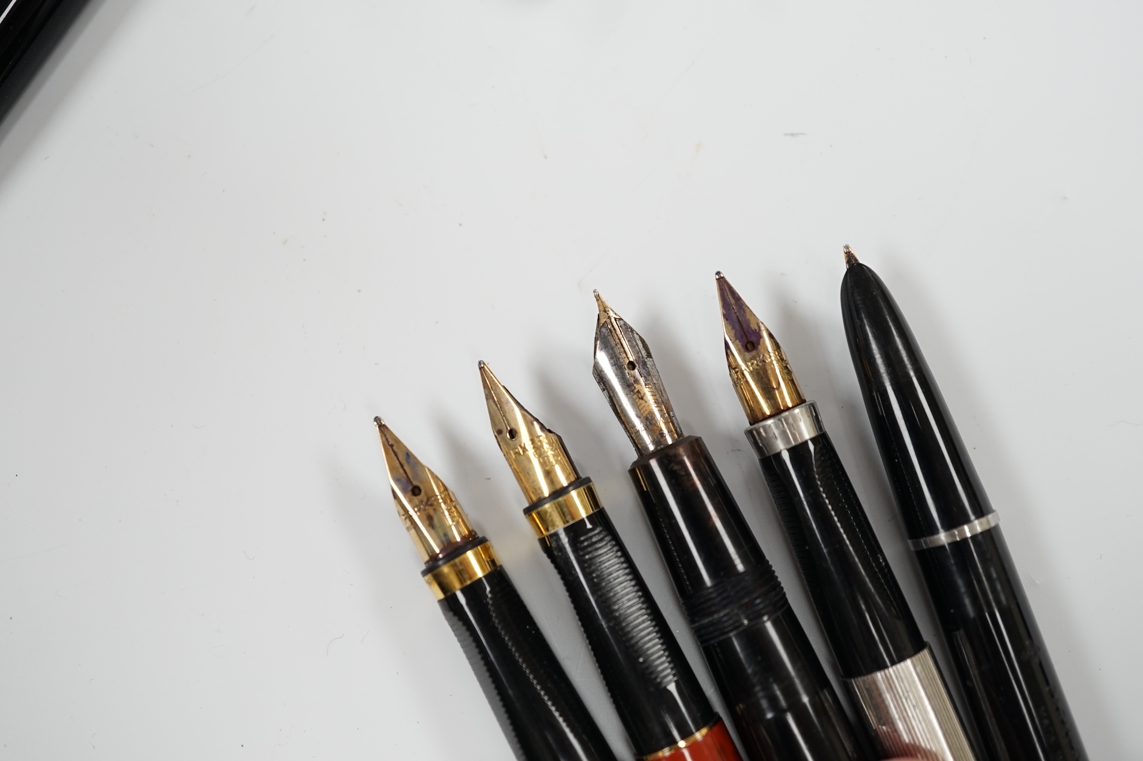 A Parker white metal fountain pen and four other Parker fountain pens, the vendor being an ex-Parker Pen employee